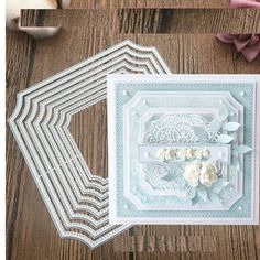 some paper flowers are sitting on top of a wooden table next to scissors and other crafting supplies