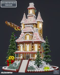 a large building made out of legos with christmas decorations on the front and side