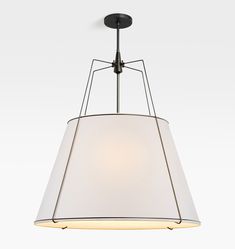 a light fixture with a white shade hanging from the ceiling