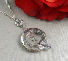 This fantasy inspired locket is 30 inches long. Sterling silver intique platted round locket has beautiful engraved floral patterns on the sides. I have set a tiny cute vintage silver mermaid embellishment in the middle of locket. Next to that is moon Goddess, sitting on the side watching over. Necklace is hanging from antique silver floral link. Pendant is finished with silver chain and silver lobster clasp. Locket is 32mm in size. It has room for two photos inside! Please let me know at checko Bohemian Engraved Round Locket Necklace, Bohemian Engraved Round Pendant Locket Necklace, Moon Locket, Mermaid Locket, Mermaid Moon, Silver Mermaid, Round Locket, Mermaid Jewelry, Silver Locket