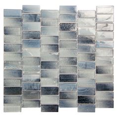 a glass tile wall with gray and white squares