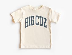 If you love super soft, lightweight, extremely comfy shirts and baby bodysuits then you will absolutely love our unisex kids shirts and baby bodysuits! These shirts are hand printed with a professional garment printer for a soft, durable, long lasting, printed graphic using high quality water based inks. * The printed design is very soft to the touch due to our printing process blending the eco-friendly ink directly into the garment. * Shirt and design colors may vary slightly due to monitor and lighting. * This is a Unisex style tee kids tee, please see our sizing charts in the images for a look at either toddler, youth and baby sizes in detail. * Solid Colors: 4.2 oz., 100% airlume combed and ringspun cotton * Shirts & Bodysuits Run True to Size * Tear-away label * Pre-Shrunk * Machine w Big Cousin Shirts, Cousin Shirts Adults, New To The Cousin Crew Onesie, New Cousin Shirt, Best Big Cousin Shirt, Big Cousin Shirt, Outfit Boho, Cousin Crew, Comfy Shirts