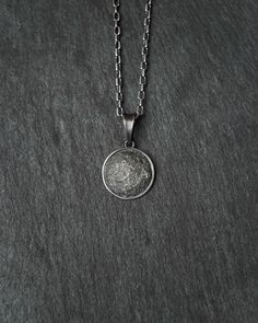 Full Moon silver pendant Metal: Sterling Silver 925 The pendant measures: 16,7 x 16,7 mm Crafted from sterling silver, this exquisite pendant beautifully captures the allure of the full moon. The intricate details highlight the lunar surface, reflecting its celestial charm. Adorn your neckline with this stunning piece, a tribute to the mystique and elegance of the moon's ethereal beauty. Sterling Silver Necklaces With Polished Round Disc, Elegant Silver Round Disc Necklace, Sterling Silver Medallion With Moon Charm, Sterling Silver Moon Charm Medallion Jewelry, Sterling Silver Medallion Jewelry With Moon Charm, Silver Moon Necklace With Oxidized Finish, Sterling Silver Sphere-shaped Jewelry, Silver Oxidized Moon Shaped Jewelry, Elegant Moon-shaped Engraved Necklace