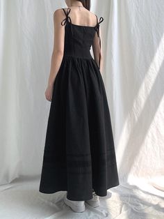 Turn heads with this stunning black maxi dress, serving major goth aesthetic goals. Crafted from smooth polyester, it features a stylish square neck and a chic back tie fastening. Plus, there's an invisible zip at the back for a seamless look. Whether you're hitting the town or keeping it chill, this dress is your new go-to for darkly dreamy style. Goth aesthetic Polyester Square neck Back tie fastening Invisible zip fastening at back Dark Academia Party, Corset Long Dress, 2000s Clothes, Y2k Dresses, Elegant Party Dresses, Goth Dress, Goth Aesthetic, Maxi Styles, Vestidos Vintage