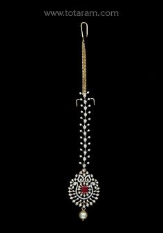 18 karat gold "detachable" diamond maang tikka cum pendant - papidi billa with color stones & south sea pearls
  this product can be used as pendant.
  this product has inter changeable stones in the pendant.
  gross weight of the pendant without chain : 7.750 grams
  gross weight of the diamond tikka chain without pendant : 4.800 grams
  length of the pendant : 1.90 inches
  width of the pendant :  0.95 inches
 - 235-GT490 - in 12.450 Grams for USD $2,765.73 USD. 
Made in India by Totaram Jewel Uncut Diamond Maang Tikka, Diamond Tikka Designs, Festive Gold Tikka With Pearl Drop, Gold Cutdana Tikka Temple Jewelry, Diamond Mang Tika, Vvs Diamond, 22k Gold Jewelry, Sea Pearls, Gold Jewelry Indian