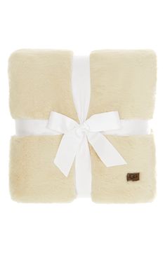 a white blanket with a bow on it