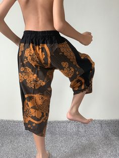 "For Kids Samurai Pants - elastic waistband and cuffs - Fits all! Unisex pants These beautiful casual pants is unique & comfortable to wear Handmade with a very lovely pattern, it is easy to wear and great for many occasions. One size fits most. These pants are great for many different activities like traveling, dancing, going to festivals, rock climbing, yoga, meditation, massage, working out, martial arts, Taichi MATERIAL: 100% Cotton APPROX MEASUREMENT: Size XL Waist: 20\"- 28\" Length: 2 Flare Yoga Pants Outfit, Samurai Pants, Cotton Ball Lights, Handmade Pants, Yoga Pants Pattern, Fisherman Pants, Summer Pants Outfits, African Dashiki, Unisex Pants