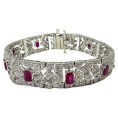 Indulge in the ultimate luxury with our 18k Diamond and Ruby Bracelet. Crafted from 18k white gold and adorned with 3.85 carats of dazzling diamonds and 4.54 carats of radiant rubies, this bracelet exudes elegance and sophistication. With a length of 7 inches and a weight of 46.45 grams, it is the perfect statement piece for any occasion. Trust us, you won't be able to take your eyes off this exquisite beauty! 18k Diamond and Ruby Bracelet Condition: In good condition with some minor surface wear consistent with age. Length: 7 inches Markings: "750" Metal: 18k White Gold Weight: 46.45 grams Diamonds: 3.85 carats Ruby: 4.54 carats Cocktail Bracelet, Diamond Pendants Designs, Contemporary Engagement Rings, Ruby Bracelet, Modern Bracelets, Diamond Pendants, Sapphire Bracelet, Fine Jewelry Bracelets, Pendant Design