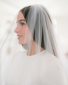 a woman with a veil on her head