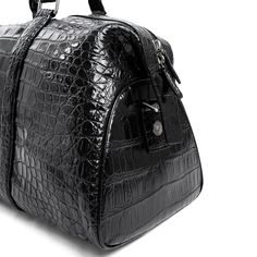 Elevate your travel experience with the Croco Luxe Travel Bag. This exceptional piece of luggage is meticulously crafted from genuine crocodile leather, celebrating the untamed beauty of nature. Its exquisite, natural crocodile texture and lustrous finish add a touch of opulence to your journeys. With ample space and practical features, it's designed to make your travels effortless and stylish. Whether you're exploring new destinations or embarking on business ventures, this travel bag seamlessl Classic Travel Bag With Crocodile Pattern, Elegant Textured Leather Travel Bag, Elegant Travel Bag With Crocodile Pattern, Elegant Travel Bags With Crocodile Pattern, Luxury Textured Leather Travel Bag For Formal Occasions, Luxe Travel, Crocodile Texture, The Untamed, Crocodile Leather