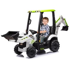 a young boy riding on the back of a toy tractor