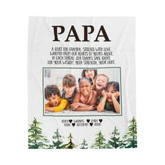 a tea towel with the words papa on it and two children in front of them