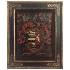 an ornate wooden frame with a coat of arms on it