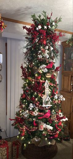 a decorated christmas tree in a living room