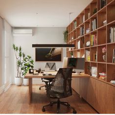 a home office with bookshelves, desk and chair