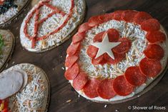 several pizzas with different toppings on them are arranged in the shape of captain america