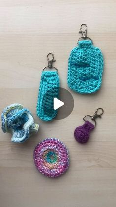 crochet key fobs are displayed on a table with the video showing them