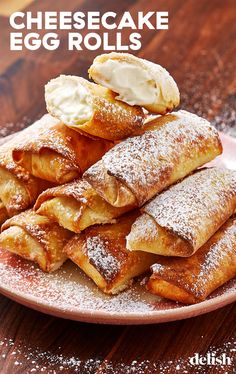 some crepes are stacked on top of each other with ice cream and powdered sugar