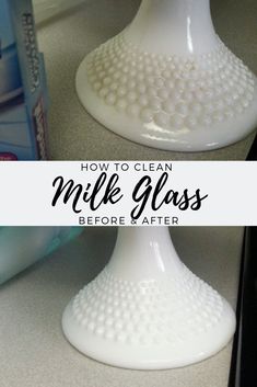 a white glass vase sitting on top of a counter next to a toothbrush holder