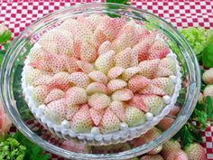 there is a cake made out of strawberries on the table