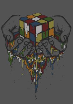 two hands holding a rubix cube in front of dripping paint on a gray background