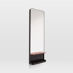 a mirror and shelf on a white background