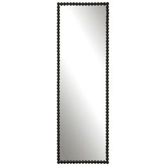 a mirror that is sitting on top of a table with beads around the edges and in front of it