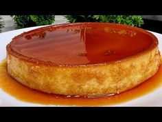 a cake covered in caramel sauce sitting on top of a white plate