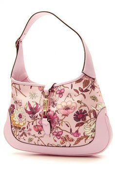 Update your handbag collection with this authentic Gucci Limited Edition Jackie hobo. This Haute hobo features a signature pink Flora printed canvas with light pink leather details and a gold-tone piston lock. The perfect size for everyday wear, this handbag has ample room to carry your daily essentials. Condition - Like NewThis bag is in excellent condition with no signs of use. This Gucci item is guaranteed to be authentic or your money back. FeaturesMaterial: CanvasColor: Light PinkLength: 13 Handbag Collection, Fancy Bags, Cute Purses, Printed Canvas, Bag Light, Pink Leather