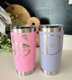 two personalized tumblers sitting next to each other