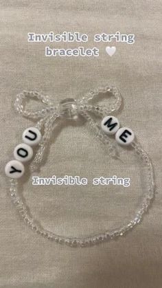 a bracelet with words written on it and the word voie spelled in white beads