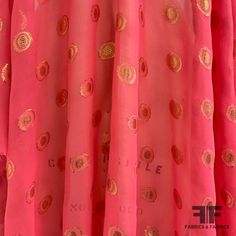 This pretty silk chiffon is a gold and pink color. Unique for the intricate gold polka dots composed of two concentric circles, this silk chiffon is a popular choice for a long evening dress, cocktail dress, sheer overlay, or scarf. This fabric is sheer, therefore a lining is needed if additional structure and modesty is desired. Also available in green, SKU#: 6691. SKU: 6690 Content: Silk/Lurex Blend Color: Gold And Pink Width: 43 inches Origin: Italy Concentric Circles, Long Evening Dress, Fashion District, Gold And Pink, Sheer Overlay, Gold Polka Dots, Multi Pattern, Gold Fabric, Dress Cocktail