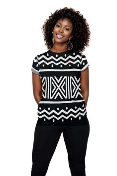 Introducing our African Zigzag Print Women T-shirt - a unique and stylish addition to your wardrobe. Made with high-quality fabric, this shirt boasts a chic zigzag print that adds an eye-catching touch to any outfit. Embrace the beauty of African design and elevate your fashion game with this must-have piece. Product Features Please Compare your Measurements To our Size Chart This T-shirt is Designed for fashionable women. Made from 5.47 Oz. 100% polyester. Double-needle hemmed sleeves and botto Trendy Cotton Tops With Bold Print, Crew Neck Cotton Tops With Abstract Print, Cotton Crew Neck Tops With Abstract Print, Trendy Black Tops With Abstract Print, Trendy Black Top With Abstract Print, Trendy Short Sleeve Tops With Abstract Print, Black Crew Neck Top With Abstract Print, Short Sleeve Graphic Tee With Abstract Print, Black Casual T-shirt With Abstract Print