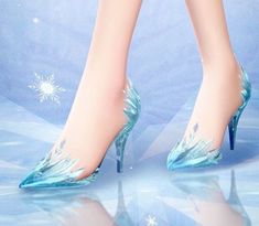 a woman's legs wearing blue high heels with snowflakes on them