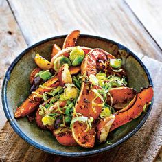 a bowl filled with carrots, brussels sprouts and brussel sprouts