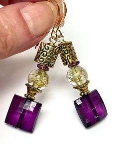 "Vintage Aubergine Purple Faceted Square Lucite Bead, Vintage Gold Drizzle Yellow Lucite Round Bead, Vintage German Purple Glass Beads, Gold Etched Square Medallion Bead, Gold Plated Long Ear Wires Vibrant colors of purple ,yellow and gold have been combined in these long light in weight lucite bead earrings. The bottom purple faceted square bead measures approximately 1/2\" x 1/2\" - the top gold bead mimics this same shape but is 3/8\" x  3/8\". A vintage German yellow lucite round bead with g Sugar Beads, Long Light, Square Bead, Vintage Lucite, Custom Earrings, Beaded Dangle Earrings, Purple Glass, Bead Earrings, Beaded Dangles