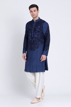 Blue kurta featuring embroidered patch in geometric pattern with silk resham detailing. Paired with a contrasting plain dhoti pant. - Aza Fashions Embroidered Indigo Kurta For Transitional Season, Eid Designer Wear Kurta With Woven Motifs, Traditional Indigo Embroidered Kurta, Traditional Embroidered Indigo Kurta, Traditional Indigo Kurta With Floral Embroidery, Blue Traditional Wear With Woven Motifs For Navratri, Dhoti Pants For Men, Kurta With Dhoti, Blue Kurta