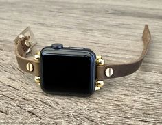 High Quality Slim Brown Color Leather Strap with Gold Accents. Women Style Classy Strap with Adjustable Buckle. Gorgeous Design Bracelet Tailored to Perfection. Designed And Handmade by Simeon D Jewelry Studio. This Bracelet Fits ALL Apple Watch Series. Please Measure Your Wrist Before Submitting Your Order! Not For Other Models. Apple Watch Is NOT Included. Let's be Friends! Follow my Studio on Social Media Instagram @simeondjewelry Pinterest @simeondjewelry Facebook @simeondjewelrystudio Apple Watch Bracelet, Slim Watches, Apple Watch Bracelets, Leather Apple Watch Band, Gold Apple Watch, Gold Apple, Design Bracelet, Apple Watch Bands Leather, Apple Watch 38mm