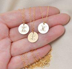 "This 14k gold filled necklace will be custom engraved with your choice of upper case initial in a beautiful ornate font and attached on a shimmering 14k gold filled chain. Please select initial and length from the drop down menus. The length does not include the pendant. Components: Disc - 14k gold filled, 13x11mm (1/2\" wide). Chain - 14k gold filled *14k gold filled components are considered hypoallergenic, they will never tarnish or rust and are water safe too! Your item will arrive in a bea Gold Initial Pendant Necklace For Best Friend, Elegant Initial Pendant Jewelry For Best Friend, Personalized 14k Gold Filled Initial Necklace, Elegant Engraved Charm Necklace For Best Friend, Engraved Gold Necklace For Bridesmaid Gift, Gold Engraved Necklace For Bridesmaid Gift, Initial Necklace With Pendant For Best Friend Gift, Gold Charm Necklace With Custom Name For Gift, Elegant Hand Stamped Initial Necklace With Round Pendant