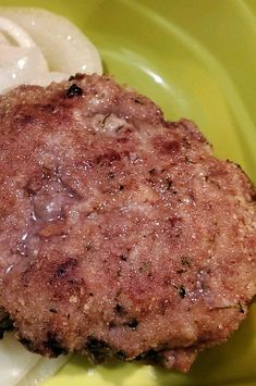 a close up of a hamburger on a plate