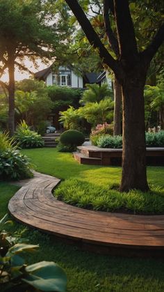 a wooden walkway in the middle of a lush green yard