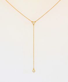 DETAILS MATERIAL 925 Sterling Silver Rhodium plated 18K Gold plated (1micron) SIZE: Zircon CHARM - approx. 5mm/0.20in Zircon drop - approx. 8.5cm/3.5in CHAIN: Trace chain with extender can be worn at 15in/38cm, 16in/41cm and 17in/43cm DESCRIPTION: Minimalist and timeless, this dainty cz lariat necklace is the perfect finish to your outfit. The necklace features slender chain in a sleek Y shape with 2 mini cubic zirconia charms. The zircon drop is approx 8.5cm/3.5 inches. The necklace fastens wit Lariat Necklace Gold, Gold Lariat Necklace, Necklace Elegant, Y Necklace, Jewelry Statement, Layered Jewelry, Necklace Dainty, Lariat Necklace, Drop Necklace