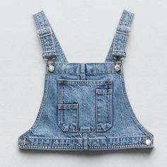 Crop Style Denim, Not Your Regular Everyday Fashion.. Stylish , Casual, Different. Button Closure On Both Sides, Straps Are Functional Buckle Hook Closure 100% Cotton Top Is A Small And Can Fit A Medium Or Medium/Large Trendy Medium Wash Denim Top With Pockets, Blue Denim Top With Pockets, Light Indigo Denim Top With Pockets, Light Wash Denim Jumpsuit With Buttons, Zara Medium Wash Denim Top With Pockets, Trendy Zara Jeans With Button Closure, Trendy Light Indigo Denim Top, Zara Denim Top With Pockets, Trendy Buttoned Denim Top