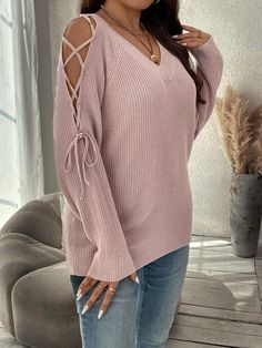 Embrace the laid-back charm with its loose fit and raglan sleeves, providing a relaxed yet trendy look. The V-neck adds a touch of sophistication, while the lace-up details elevate the overall design. Crafted from 100% Acrylic knitwear, this Tie Up Drop Shoulder Sleeve Pullover Sweater ensures a cozy feel with a slight stretch for flexibility. Whether you're lounging or stepping out, this pullover promises to be your go-to choice for effortless fashion. Experience the epitome of casual elegance