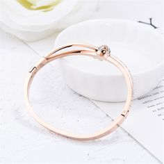 Add classic charm to your day when you slip on this sleek bangle plated with shimmering 18-karat gold and boasting a sweet bow design. 2.56'' W 18k rose gold-plated steel / cubic zirconia Rose Gold Wedding Jewelry, Bracelet Rose Gold, Cuff Bangle Bracelet, Rose Gold Bracelet, Bow Design, Rose Gold Wedding, Cuff Bangles, Jewelry For Women, Gold Wedding