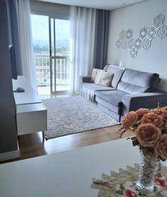 a living room filled with furniture and a flat screen tv