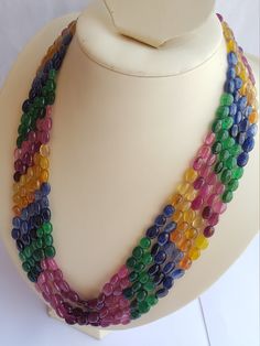 "Product Description:--- Gorgeous Multi Gemstone 5 Strands Necklace for Gift Stone Name :--- Natural Ruby, Beryl Emerald,Blue sapphire, Yellow sapphire. Gemstone Shape:--- Oval ( Smooth ) Length :---- 19 to 21\"Inches of Gemstones Approximate without Tassel / Clasp Carats:---835 Strands:- -5 Color :--- Multi Quality: --- AAA Size :--- 6 MM to 7 MM ---------------------------------------------------------------------------------------------------------- Standard delivery timeframes: - USA: about Elegant Multicolor Oval Beads Gems And Cabochons, Elegant Multicolor Oval Beads, Gems, And Cabochons, Elegant Multicolor Oval Beads, Emerald Blue, Precious Beads, Ruby Beads, Yellow Sapphire, Natural Ruby, Sapphire Gemstone