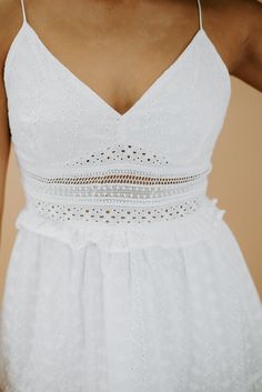 Our Forever Favorite Eyelet Mini Dress features a gorgeous lace bodice, ruffle trim, eyelet cutout under-bodice, and a slimming silhouette. This mini dress is the ideal balance between flirty yet sophisticated! Neckline: V-neckline Fabric: 100% Cotton Details: Lace bodice- no padding, ruffle trim, eyelet detail under bodice, tiered hem, adjustable spaghetti straps Imported Fit: Slimming fit; no stretch- Chest: Fitted no stretch- Flowy relaxed fit skirt Measurements:S- BUST: 12" LENGTH: 29" WAIST Fit Skirt, Skirt Measurements, Mini Dress White, Lace Bodice, Fitted Skirt, White Mini Dress, Dress White, Ruffle Trim, Spaghetti Strap