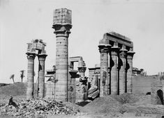 an old black and white photo of some ruins