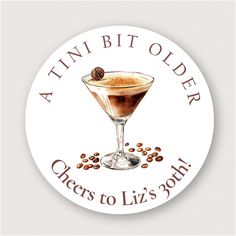 a sticker with an image of a martini glass and coffee beans on the bottom